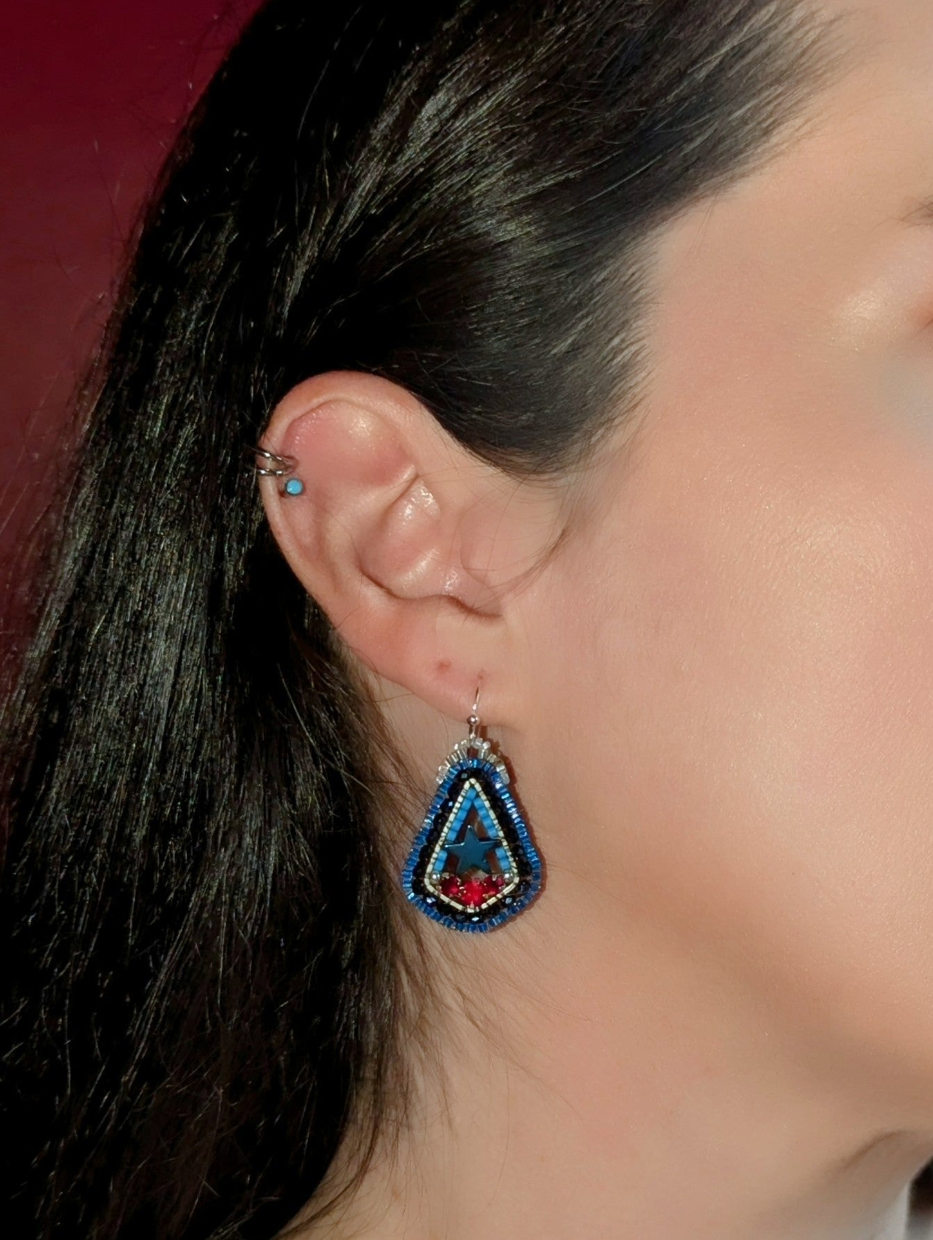 Texas inspired little drops with blue hematite stars, and Swarovski red. On sterling hooks or studs