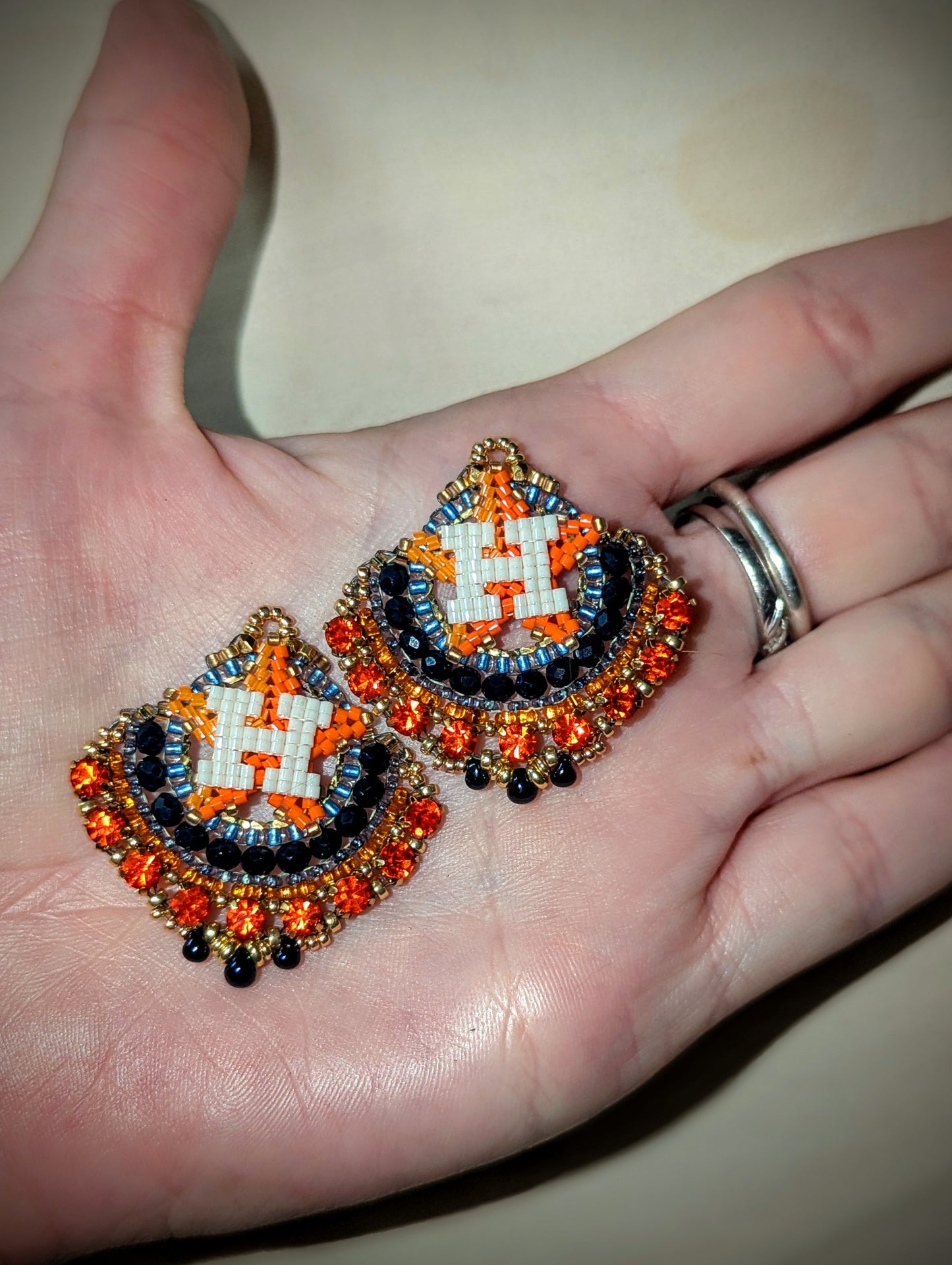 Round gold blue and orange dangles with beautiful orange crystal montees, on gold plated sterling silver hooks.