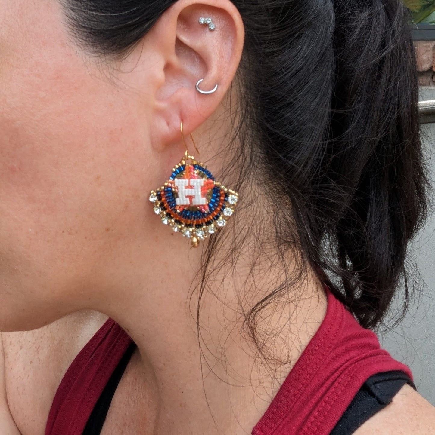 Round gold, blue, and orange dangles with beautiful white crystal montees, on gold plated sterling silver hooks.