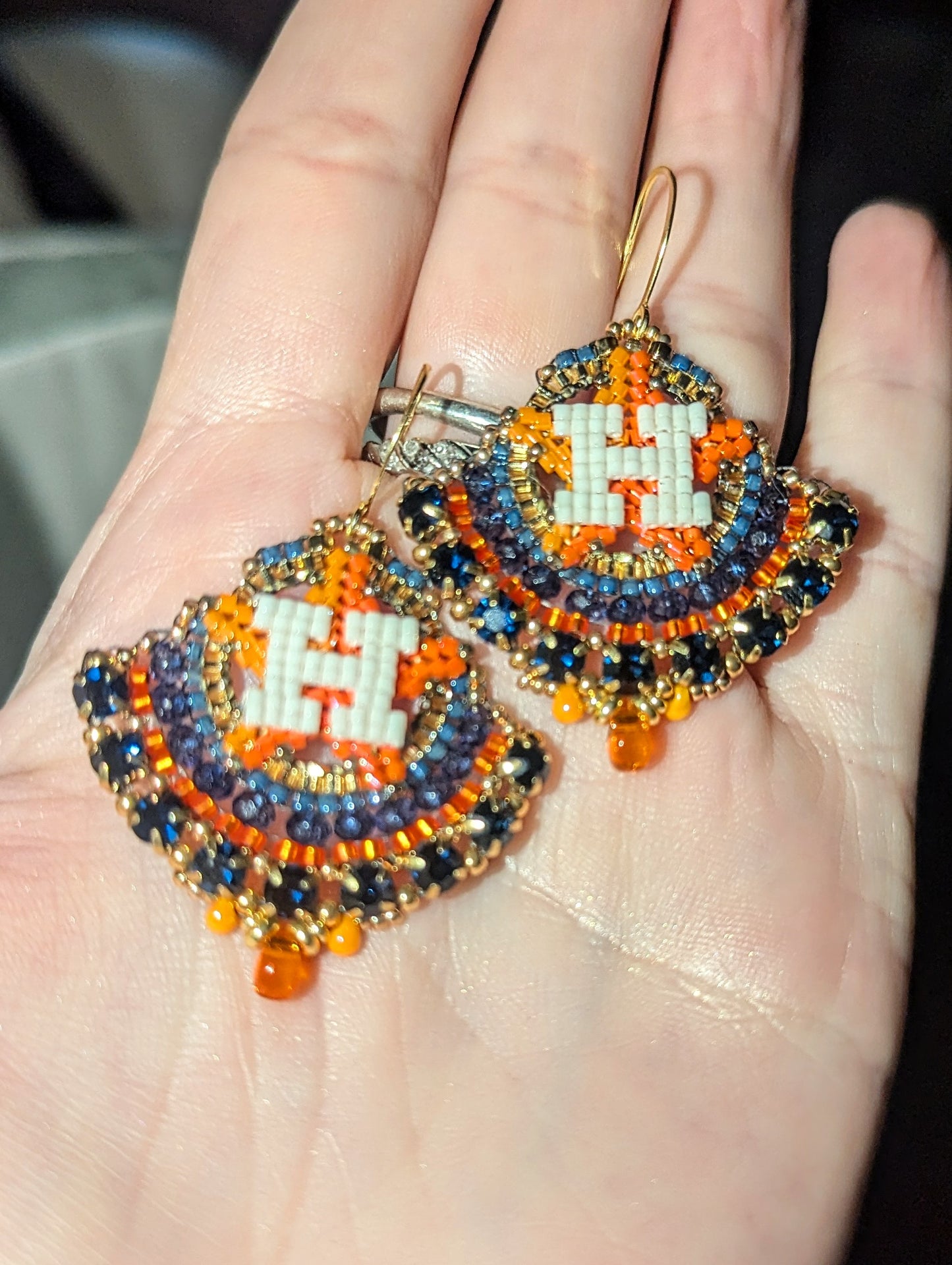 Round gold and blue dangles with beautiful blue crystal montees, on gold plated sterling silver hooks.