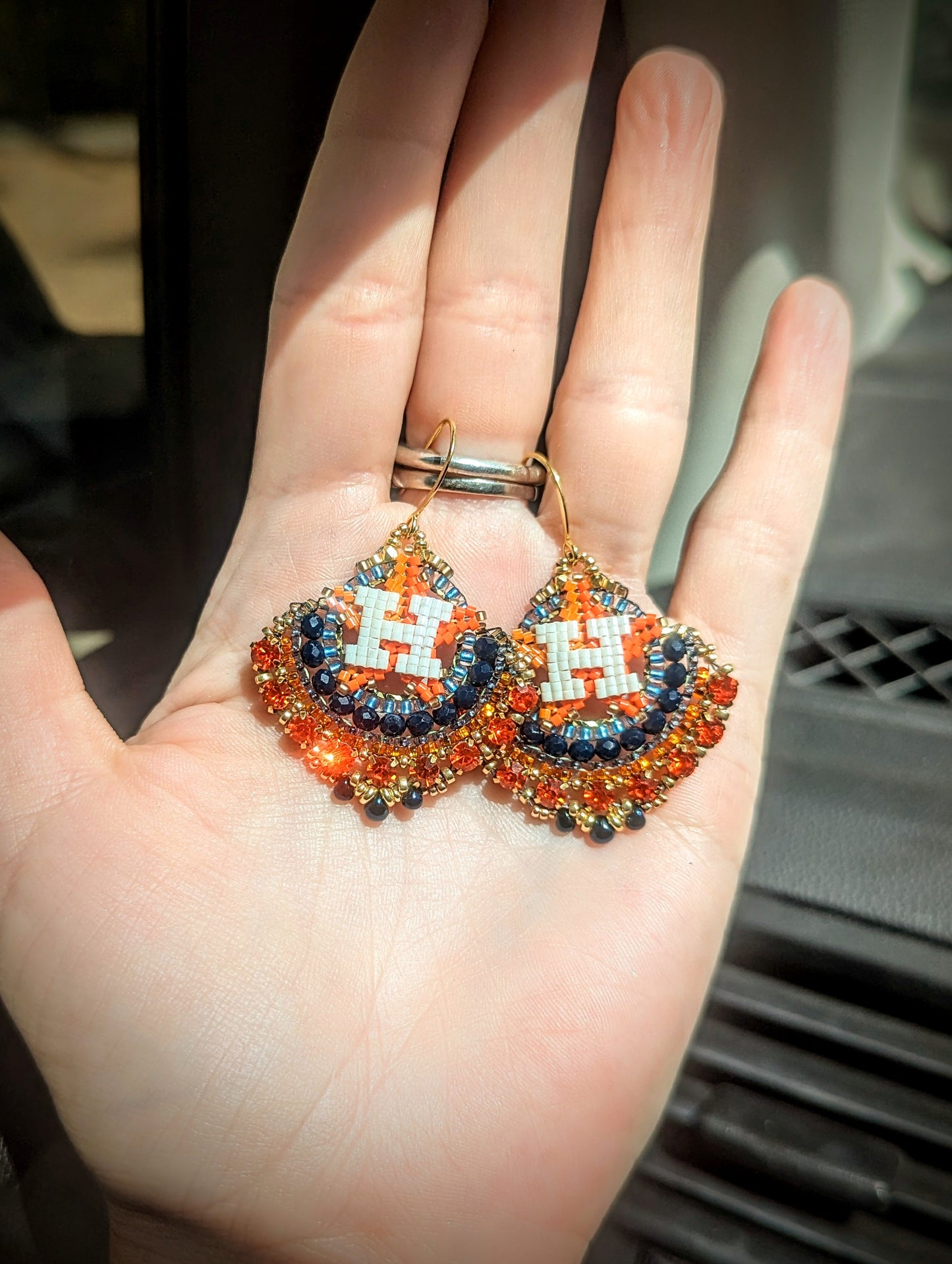 Round gold blue and orange dangles with beautiful orange crystal montees, on gold plated sterling silver hooks.