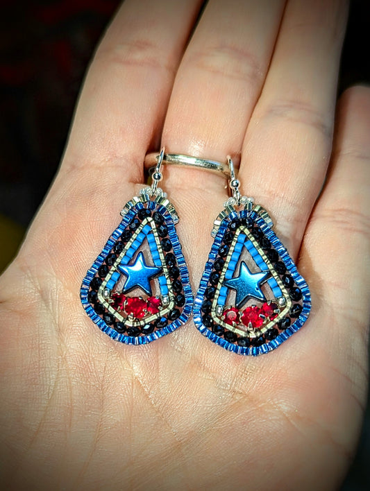 Texas inspired little drops with blue hematite stars, and Swarovski red. On sterling hooks or studs