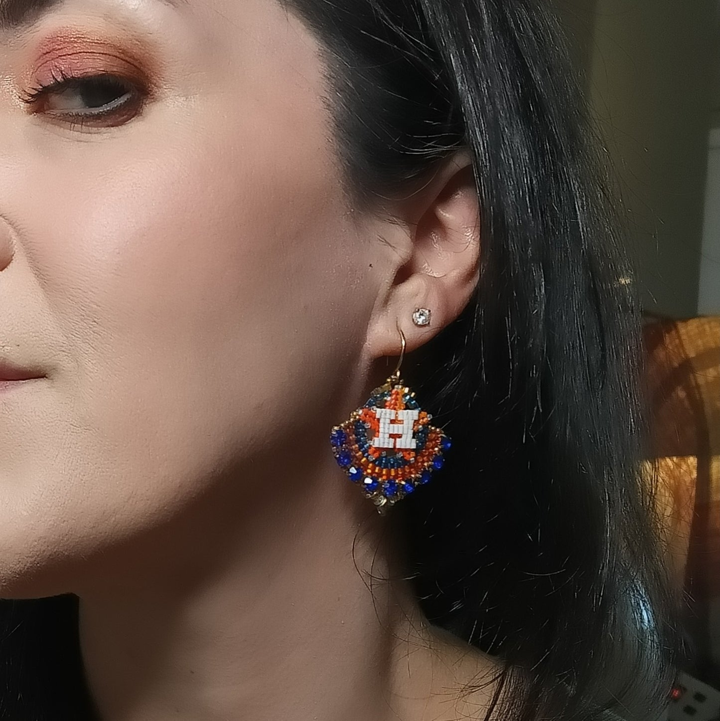 Round gold dangle with beautiful bright blue crystal montees, on gold plated sterling silver hooks.
