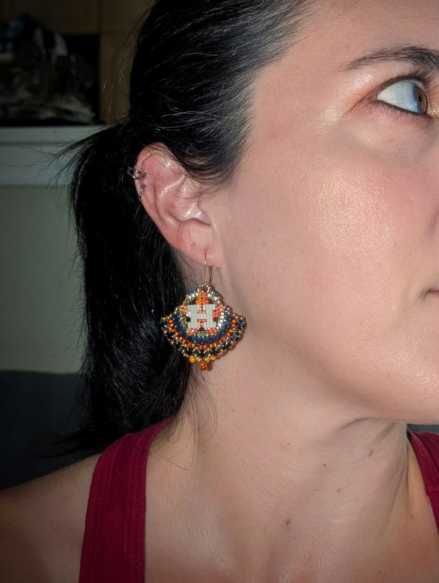 Round gold and blue dangles with beautiful blue crystal montees, on gold plated sterling silver hooks.
