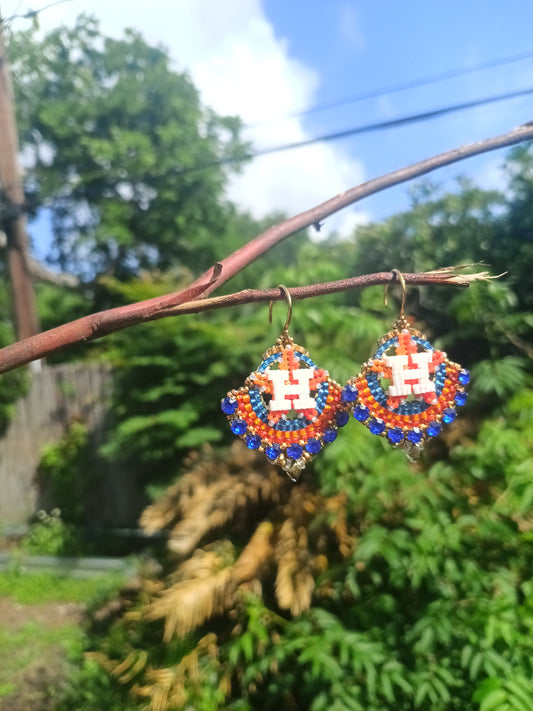 Round gold dangle with beautiful bright blue crystal montees, on gold plated sterling silver hooks.