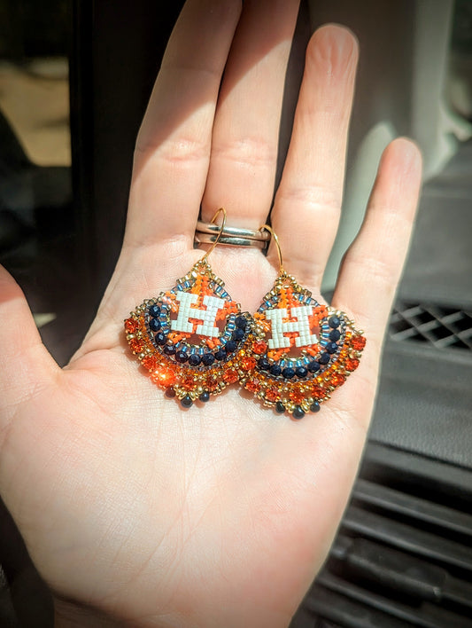 Round gold blue and orange dangles with beautiful orange crystal montees, on gold plated sterling silver hooks.